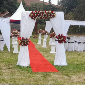 Decorated welcome signage with flowers and shears